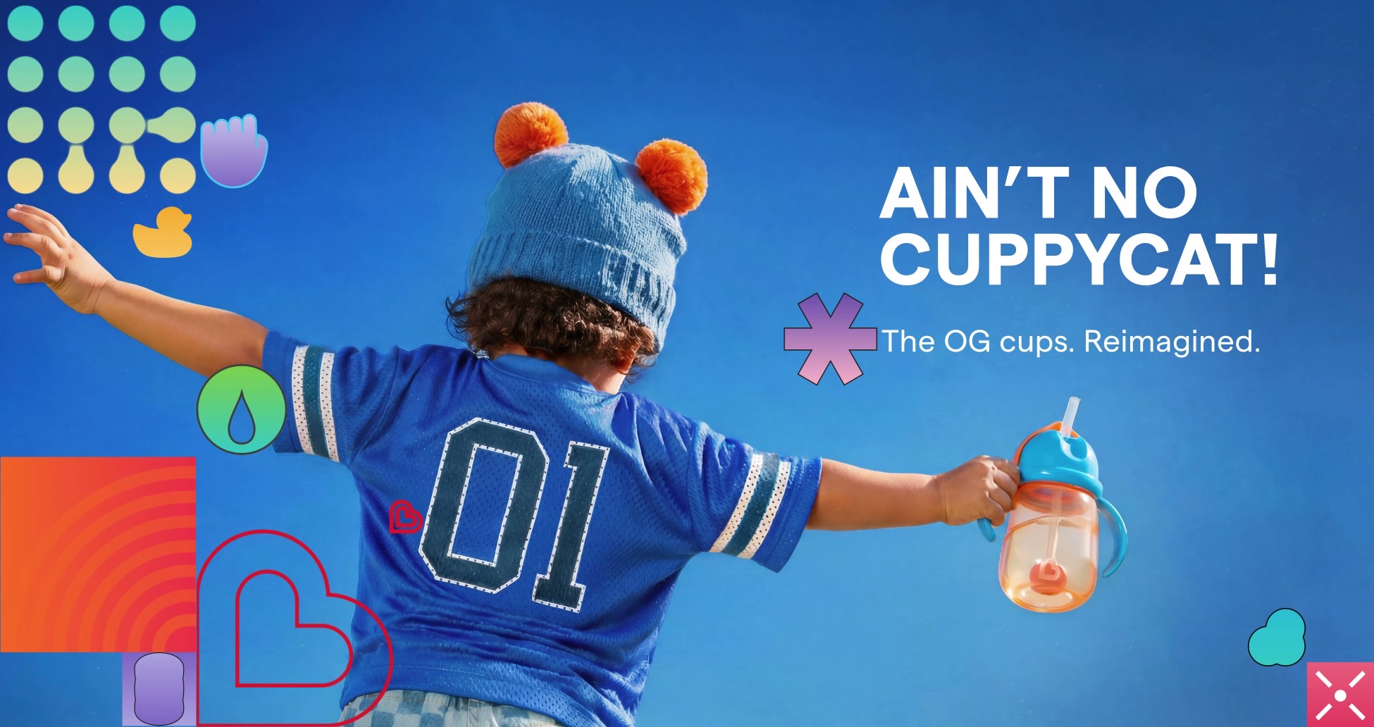 A child in a blue hat and number 01 jersey holding a Munchkin cup beside the words Ain’t no Cuppycat