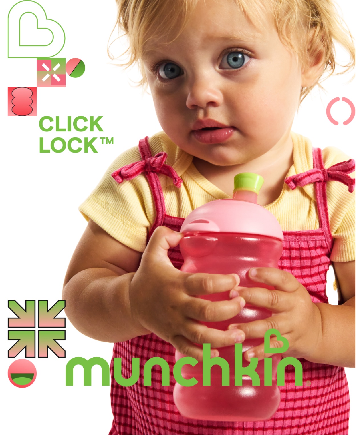 A toddler holding a Click Lock cup